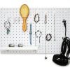 Pegboard used to organize accessory, a hair dryer, and a comb.