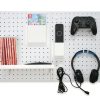 Pegboard used to organize and store gaming accessories.